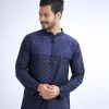 Blue semi-fitted Panjabi in Cotton fabric. Designed with a mandarin collar and matching metal buttons on the placket. Embellished with minimal embroidery on the chest.