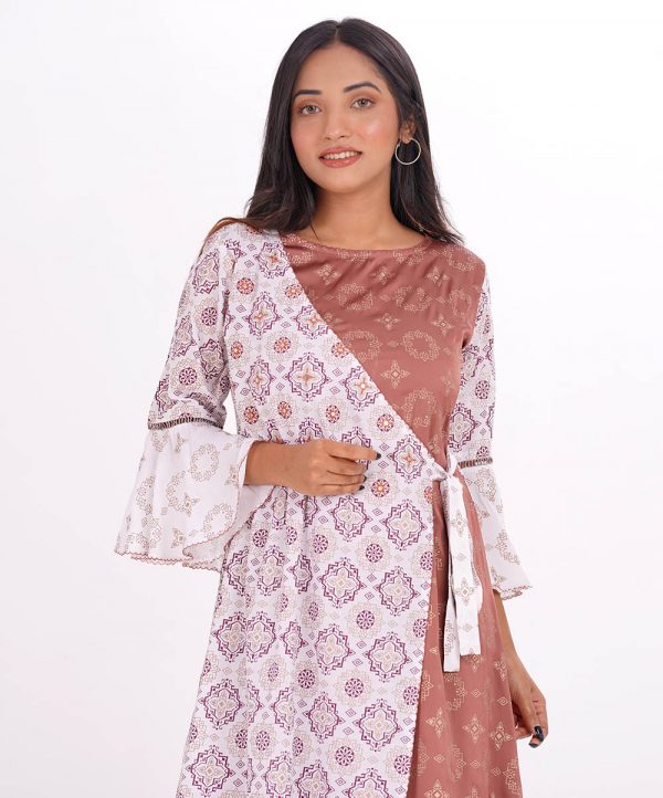 Tunic made with off-white colored viscose and pale rose-colored crepe fabric. Allover geometric print, embroidery on front, boat neck, quarter sleeve, Wrape style tunic.