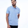 Blue Polo Shirt in Cotton pique fabric. Designed with a classic collar and short sleeves.