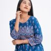 Blue all-over printed A-line Tunic in textured Silk-blend fabric. Designed with a round neck and three-quarter sleeves. Embellished with karchupi at the top front and cuffs. Viscose lining in half-body. Single button opening at the back.