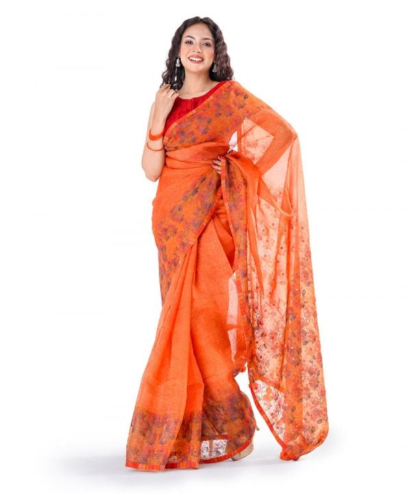 Orange all-over printed exclusive Saree in Muslin fabric with a matching border. Embellished with karchupi, and decorative tassels on the achal.