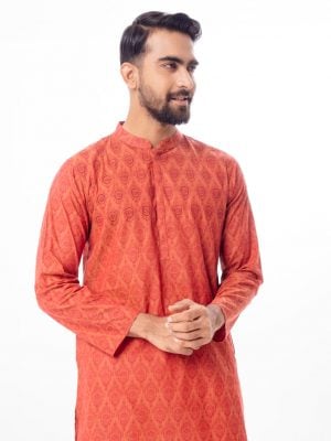 Brownish Red all-over printed semi-fitted Panjabi in Cotton fabric. Designed with a mandarin collar and hidden button placket. Embellished with embroidery on the chest.