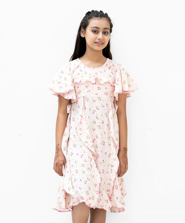 Kid girls frock in flower printed georgette fabric. Butterfly sleeved, round neck and pin tuck at front.