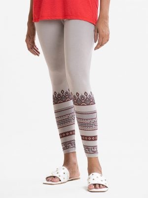 Women's leggings in stretchable cotton knit fabric. Concealed elasticated waistline. Print detail at the leg line.