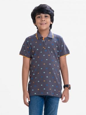 Kid boys short sleeves polo shirt in cotton pique fabric. Polka dot style turtle printed.
