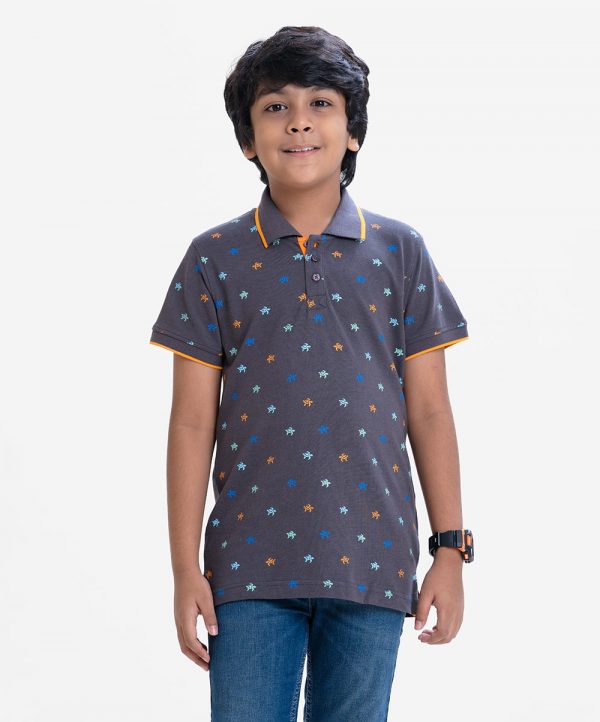 Kid boys short sleeves polo shirt in cotton pique fabric. Polka dot style turtle printed.