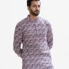 Men's fitted panjabi in ethnic printed cotton fabric. Mandarin collar and inseam pockets.