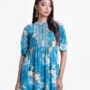 Women's frock style long tunic in printed georgette fabric. Band neck, three quarter sleeves and pin tuck at front.