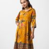 Women's frock style tunic in printed georgette fabric. Lapel collar, three-quarter sleeved. Box pleated from the waistline and attached patch work.