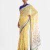 All-over printed saree in cotton fabric. Embellished with embroidery, and fringe trim at the border of anchal.