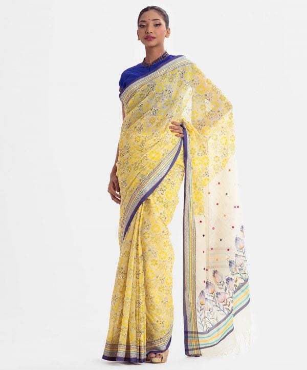 All-over printed saree in cotton fabric. Embellished with embroidery, and fringe trim at the border of anchal.