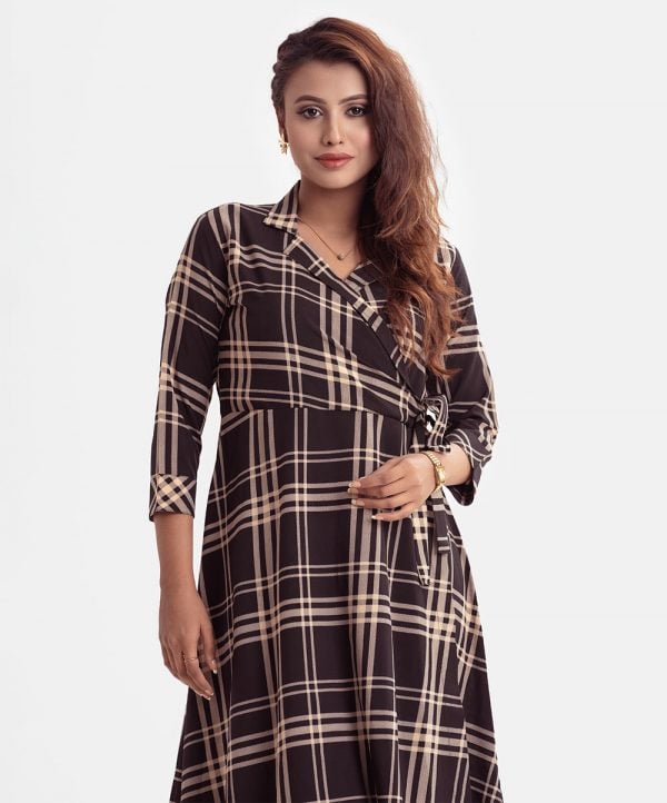 Women's A-line check retro wrap style tunic in georgette fabric. Three-quarter sleeves with roll-up and waist belt.