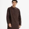 Men's semi-fitted panjabi in cotton fabric.Mandarin collar and inseam pockets. Embroidery at the front.