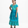 Kid girls printed frock in viscose fabric with chiffon fabric patch attached at waistline. Cap sleeves, embroidery at front and tie-cord at back.