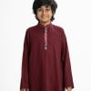 Kid boys panjabi in cotton fabric. Mandarin collar and inseam pockets. Patch at placket and line stitching at collar.