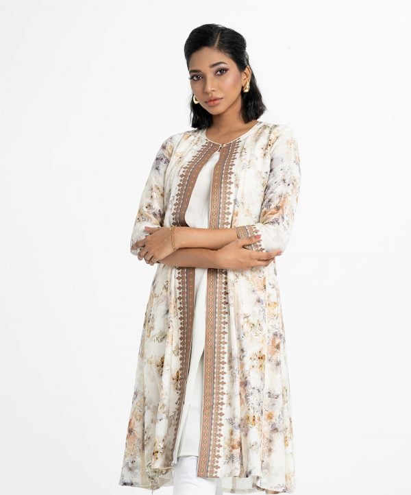 Women's floral printed shrug style kameez in blended cotton fabric. Round neck and three-quarter sleeves. Lace and patch at front and sleeves.