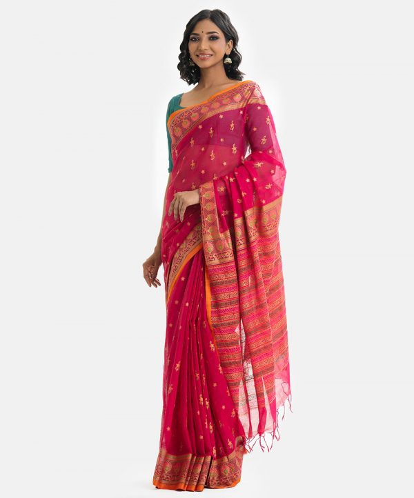 Printed saree in cotton fabric. Embellished with embroidery, and fringe trim at the border of anchal.