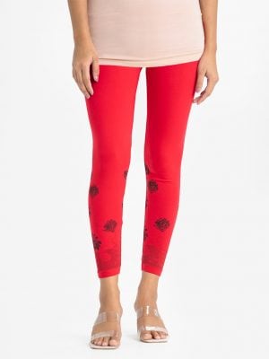 Women's leggings in stretchable cotton knit fabric. Concealed elasticated waistline and floral print on hemline.