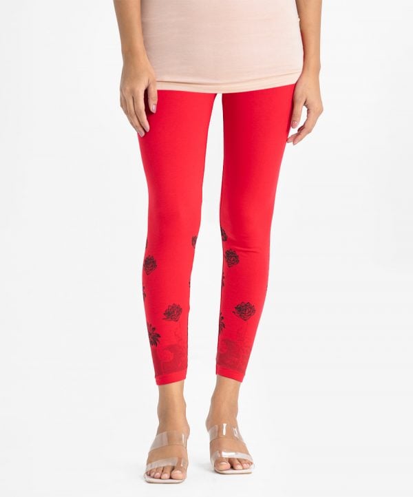 Women's leggings in stretchable cotton knit fabric. Concealed elasticated waistline and floral print on hemline.