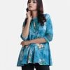 Ladies' shirt in printed georgette fabric. Stand collar, three-quarter sleeves. Metal buttons front opening with lace work at front.