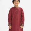 Kids boy panjabi in jacquard fabric. Mandarin collar, inseam pockets. Button fastening at the front.