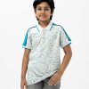 Kids boy Polo Shirt in cotton pique fabric. Classic collar, short sleeves and all over animal printed.