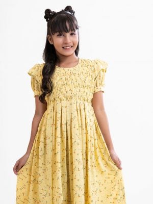 Kid girls frock in floral printed georgette fabric with half-body viscose inner. Puff sleeved and pin tuck at front with tie-cord belt.