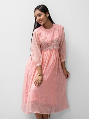 Teen girls long tunic in georgette fabric with crepe inner. Band neck, bishop sleeves, embroidery and karchupi at front.