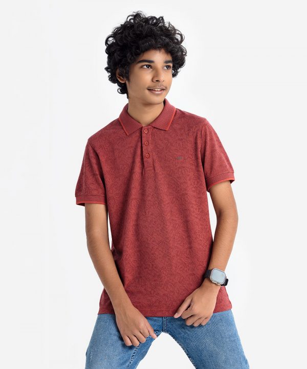 Teen boy's floral printed polo shirt in blended cotton fabric. Classic collar, short sleeves and a straight-cut hem.