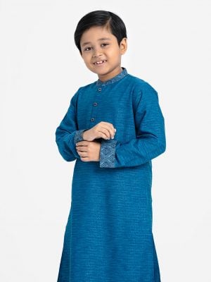 Kid boys panjabi in Jacquard fabric. Patchwork at mandarin collar and full sleeves hem. Inseam pockets.