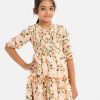 Kids girl layer style frock in printed georgette fabric. Round neck, puff-sleeved. Smokey and frill trim at the front.