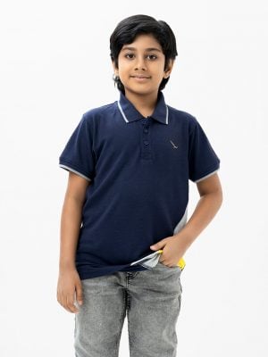 Kids boy polo shirt in cotton pique fabric. Classic collar with button placket and short sleeves.