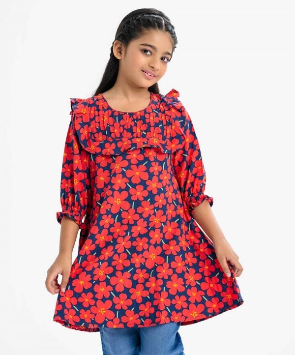 Kid girls floral printed A-line tunic in georgette fabric. Round neck with frill edge, puff-sleeved and two side pockets.