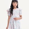 Kid girls frock in printed georgette fabric. Round neck, puff sleeves. Pin-tuck at front.