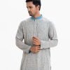 Men's fitted panjabi in viscose fabric. Line stitching at mandarin collar with metal button placket.