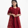 Kid girls tent-style A-line tunic in crepe fabric. Round neck, puff-sleeved. Smokey and gathered at the waistline. Button fastening at the front.