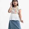 Kid girl's woven set in crepe and denim fabric. Round neck, Cap sleeves and a tassel tie-cord top. Two pockets with a show button at the front of the skirt.