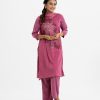 Women's printed straight salwar kameez in joom fabric. Round neck, three-quarter sleeves and karchupi at the front. Paired with a joom palazzo pant and a chiffon dupatta.