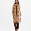 Women's printed A-line shrug style salwar kameez in jacquard fabric. Stand collar, long-sleeved with a button fastaning shrug. Crepe sleeveless kameez and round neck with line stitching at the front. Complemented with a crepe pant.